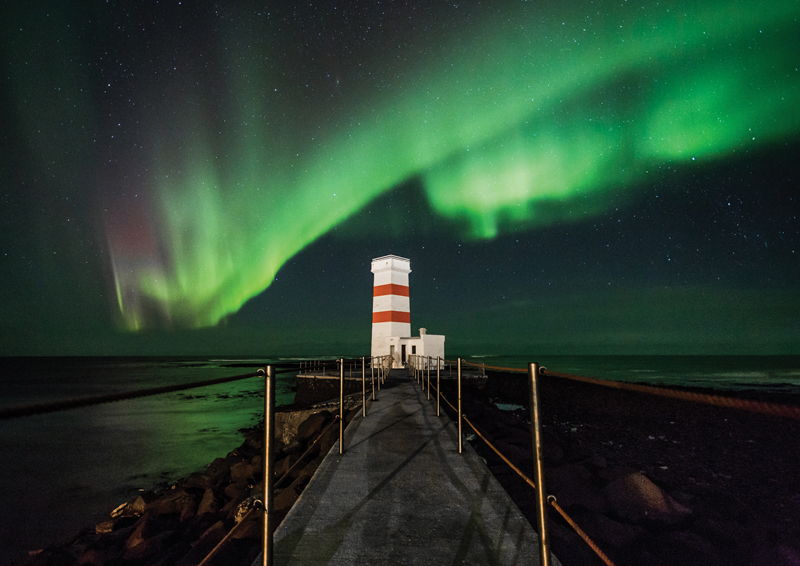The lights over the lighthouse at Gardskagi. Photograph by Gardar Olafsson