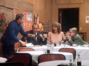 The movie "A Christmas Story", directed by Bob Clark, based on the novel, 'In God We Trust, All Others Pay Cash', by Jean Shepherd. Seen here from left, John Wong as Chop Suey Palace Owner, Darren McGavin as Mr. Parker, Melinda Dillon as Mrs. Parker, Ian Petrella as Randy Parker and Peter Billingsley as Ralphie Parker. Initial theatrical release November 18, 1983. Screen capture. © 1983 Metro-Goldwyn-Mayer / United Artists Entertainment. Credit: © 1983 MGM/UA / Flickr / Courtesy Pikturz. Image intended only for use to help promote the film, in an editorial, non-commercial context.