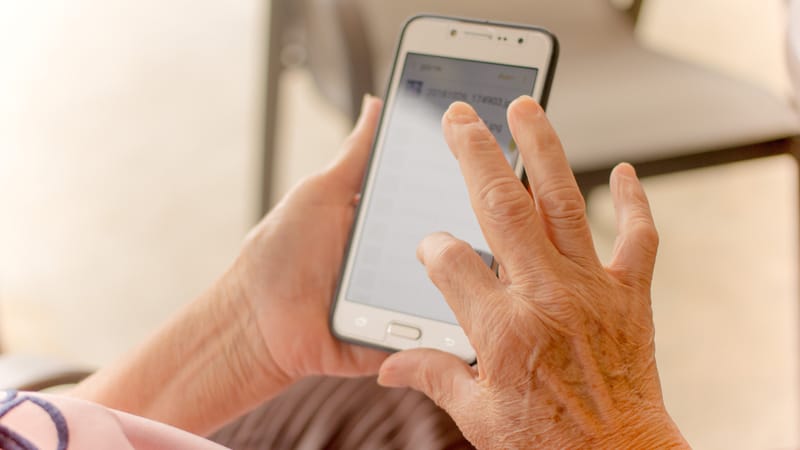 senior with smartphone. Photo by Tai Pu Ngamnil. To work out your body, reach for a set of dumbbells. But to exercise your mind, all you need is a smartphone and good brain-training apps.