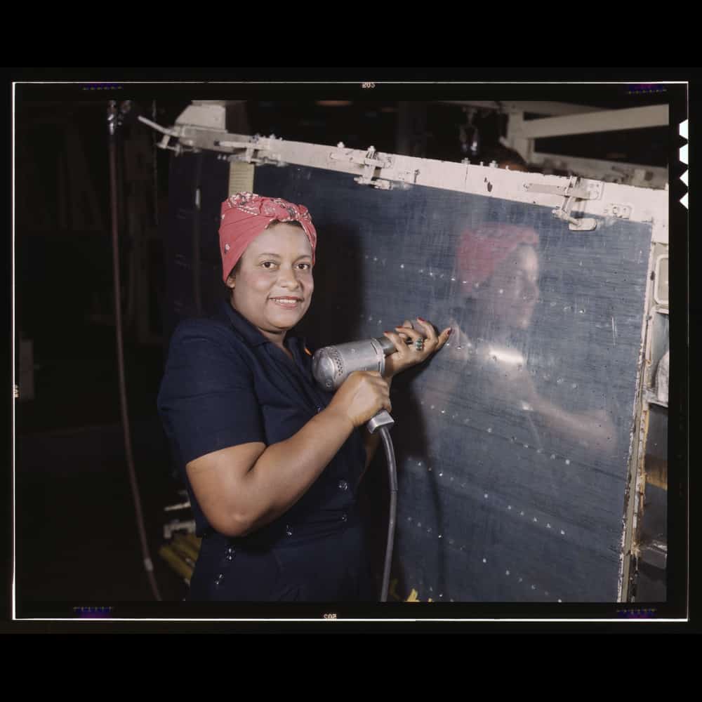 Operating a hand drill at Vultee-Nashville, working on a "Vengeance" dive bomber, Tennessee | Photograph courtesy of Library of Congress