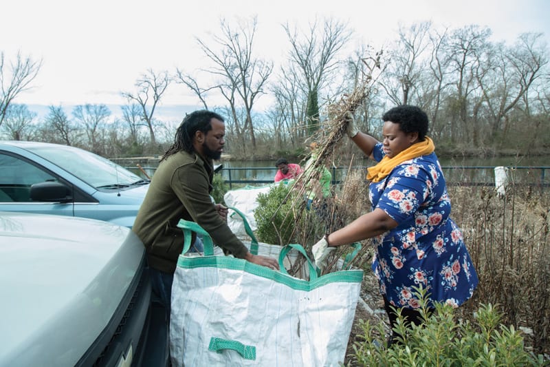 Duron Chavis Cleaning up brush at Low Line Park