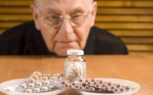 Senior man and his pills Image