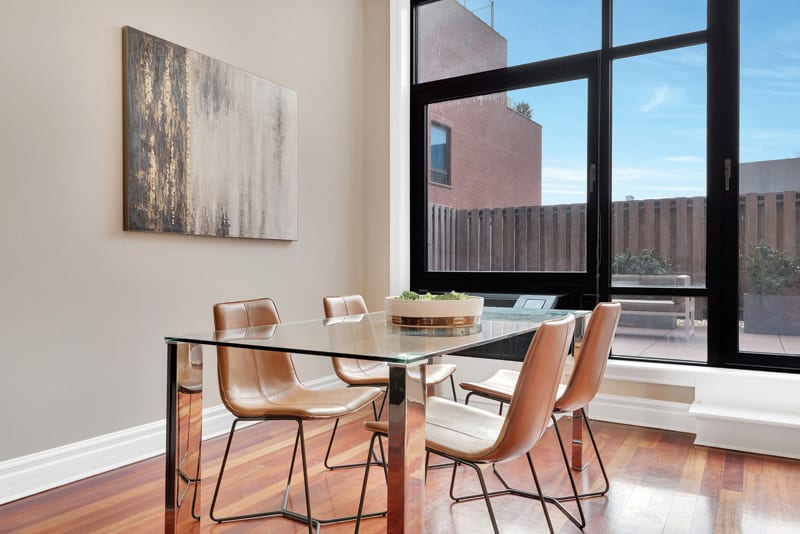 A glass table helps make a small dining area feel light and airy