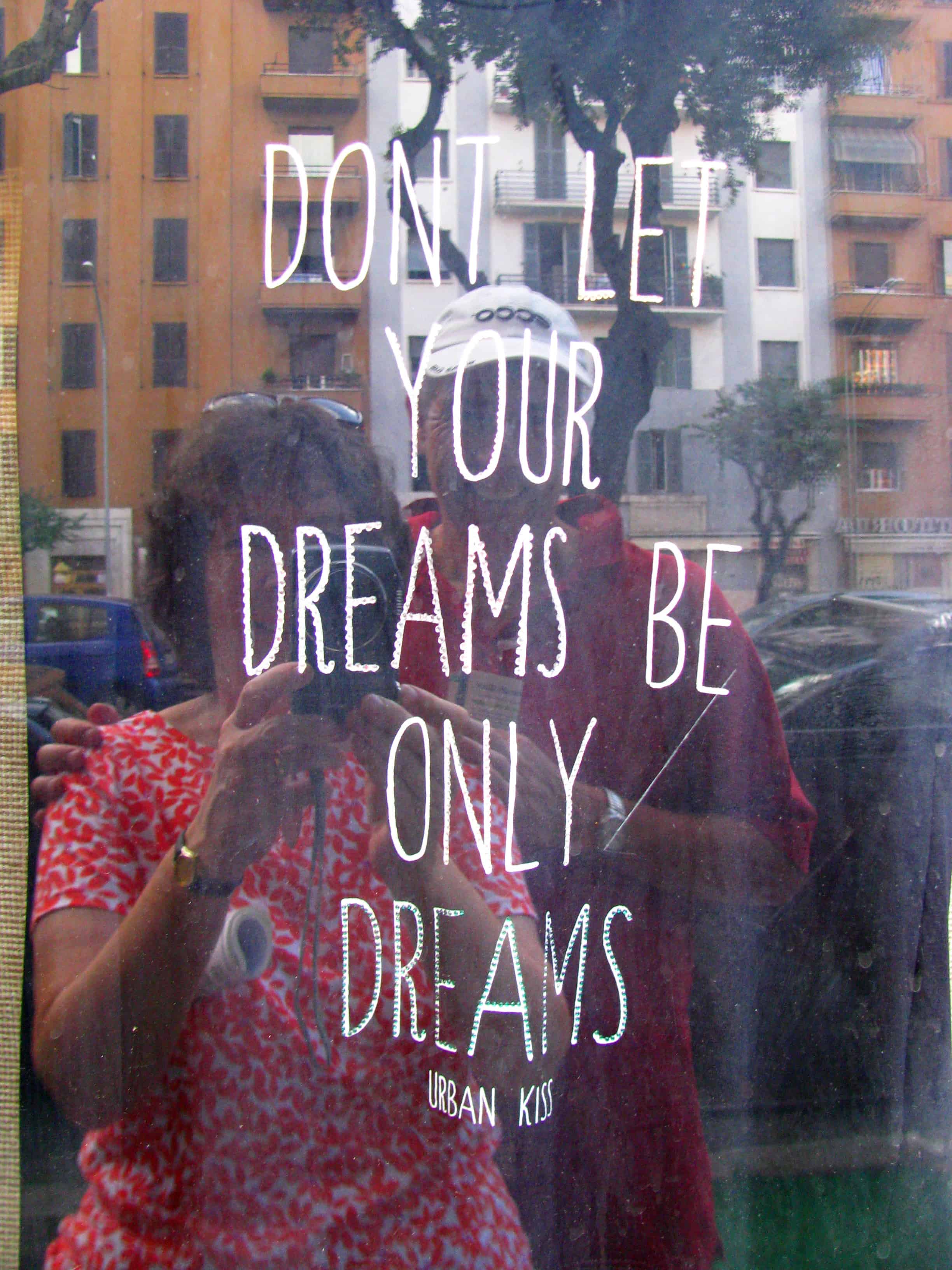 Selfie of Richard Evans and his wife and an apropos quote in a shop window