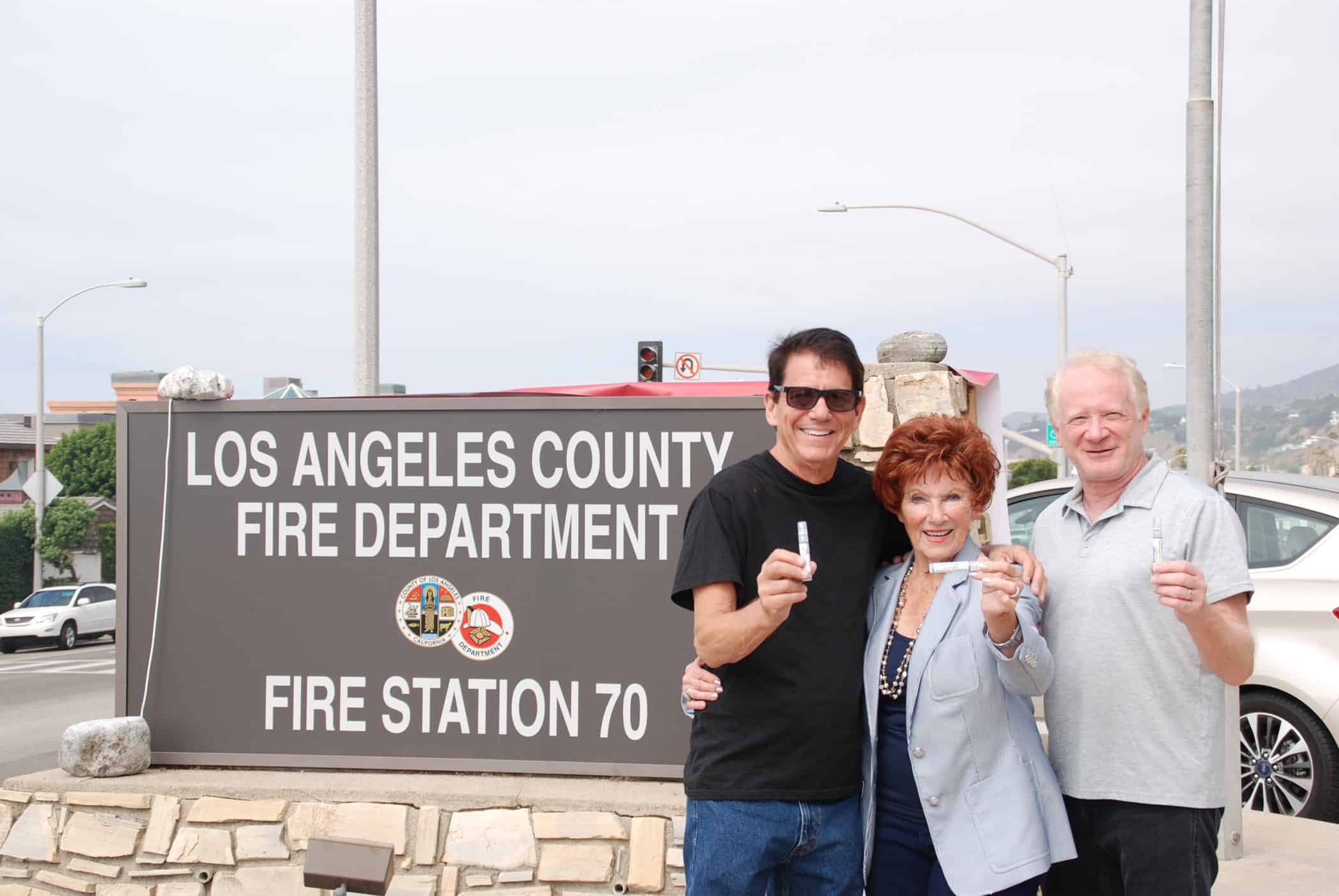 Anson Williams, Marion Ross and Don Most from Happy Days in recent photo holding containers of Alert Drops