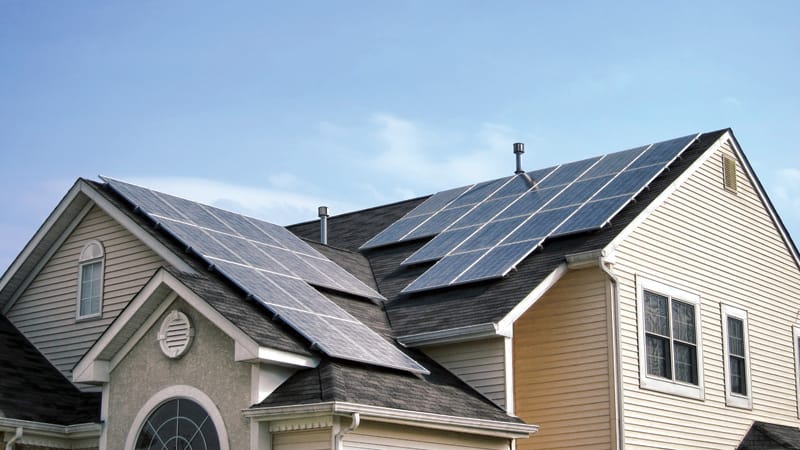 Renewable Green Energy Solar Panels on House Roof Image