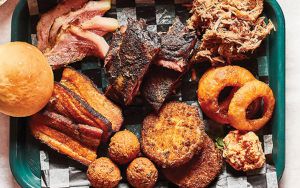 Barbecue tray from Gordonsville's BBQ Exchange with onion rings, hush puppies, pork Image