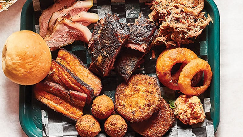 Barbecue tray from Gordonsville's BBQ Exchange with onion rings, hush puppies, pork