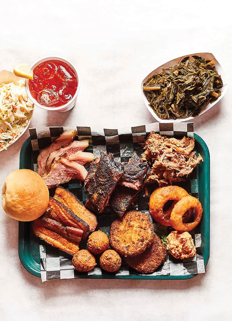 Barbecue tray from Gordonsville's BBQ Exchange with onion rings, hush puppies, pork