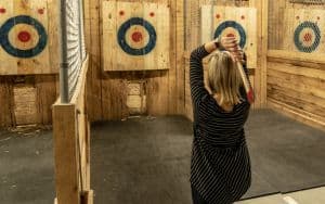Woman at axe throwing bar in Richmond Image