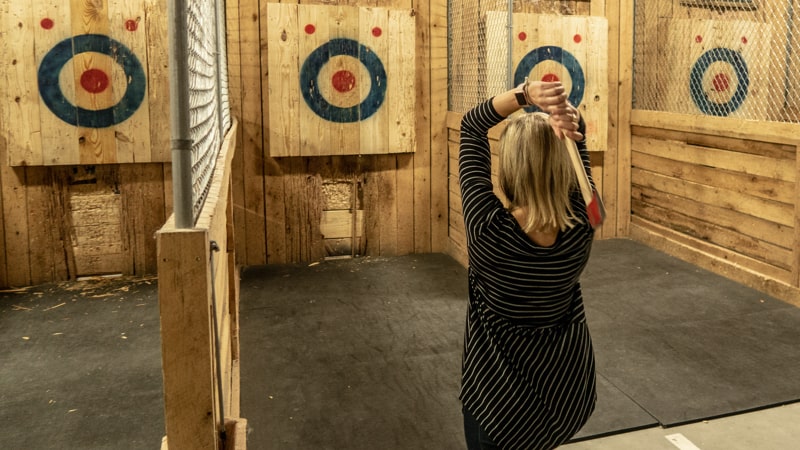 Woman at axe throwing bar in Richmond