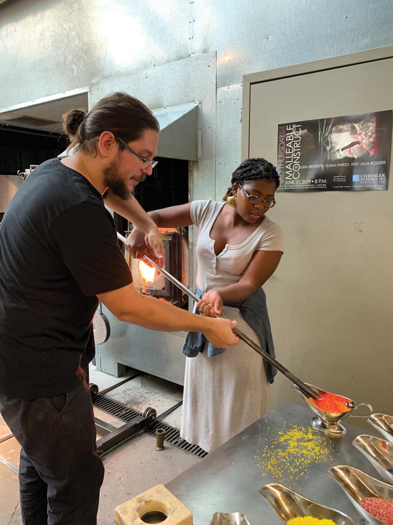 A pair of humans makes art glass at Chrysler