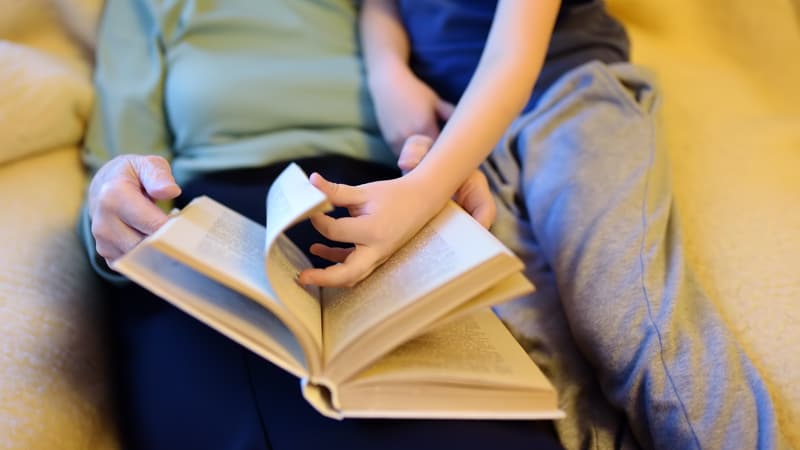 Grandma and grandson are having storytime, it's really cute