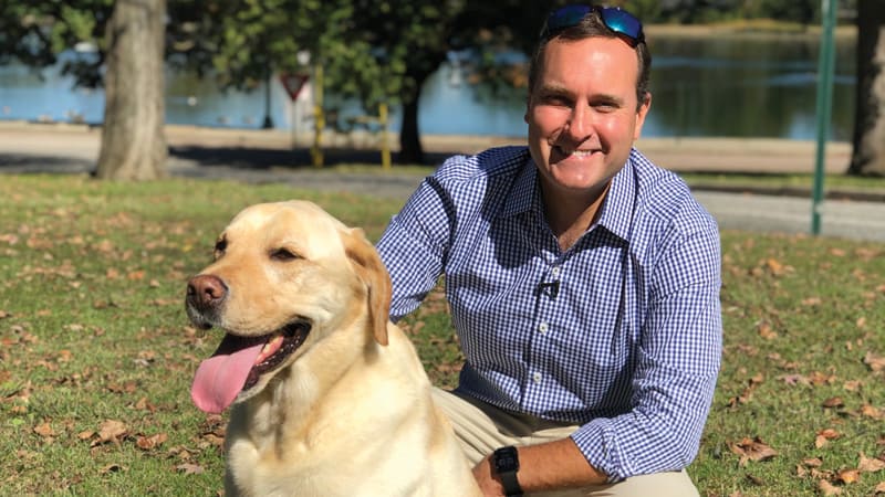 Zach Daniels with Walter the Weather Dog