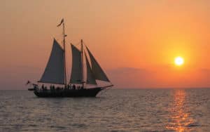 Romantic pirate ship floats off into the sunset in Williamsburg Image