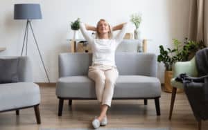 Older woman sits in a calmer home Image