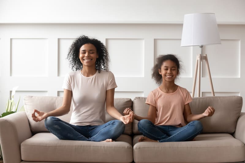 Mom and daughter can entertain by doing yoga