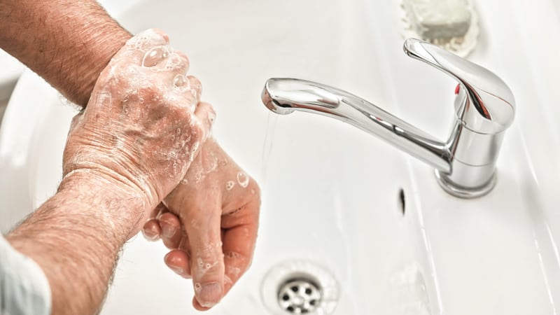 Senior practices good hygiene with handwashing