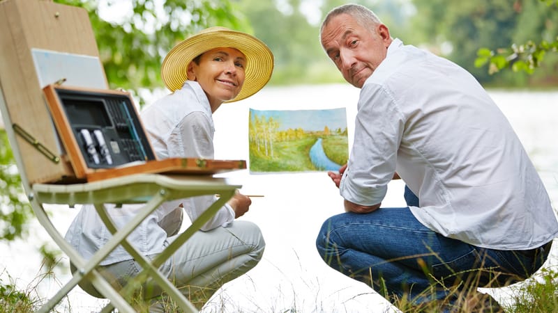 Couple Bored at Home painting outside