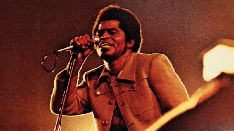 James Brown performing music in the '70s Image