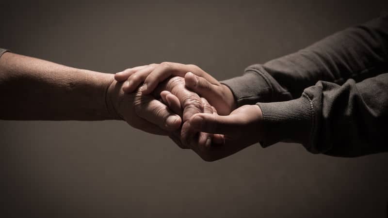 Maurice Dotson holding hands Image