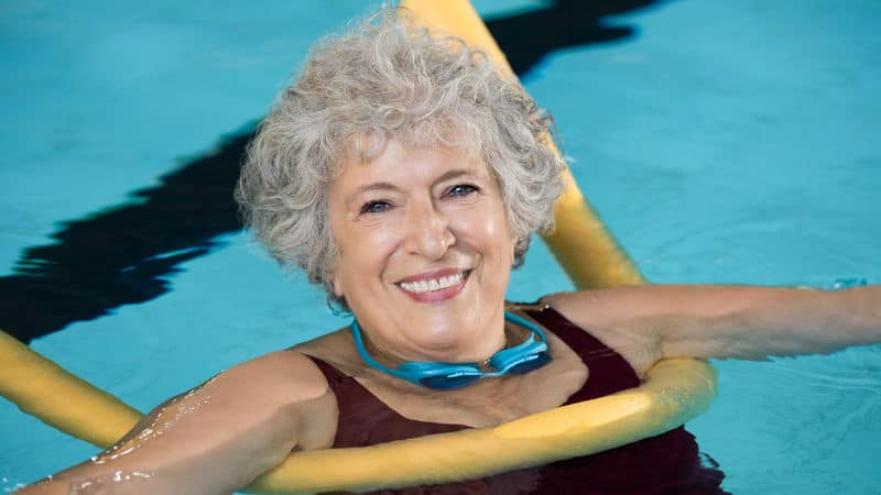 Woman swimming in the pool to help her anxiety Image