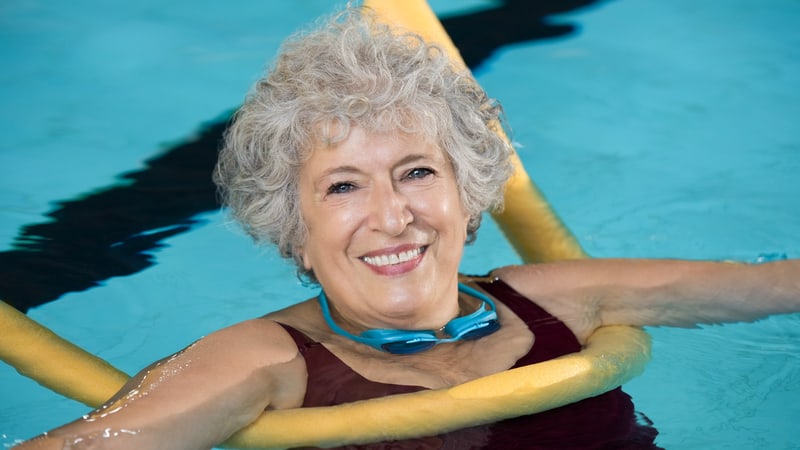 Woman swimming in the pool to help her anxiety
