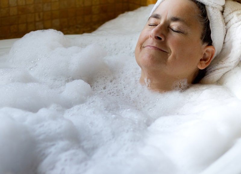 Senior woman in a bathtub relaxing