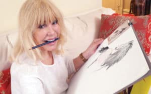 Loretta Swit showing off her art Image