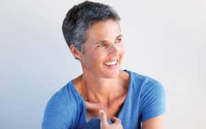 A woman currently going through menopause Image