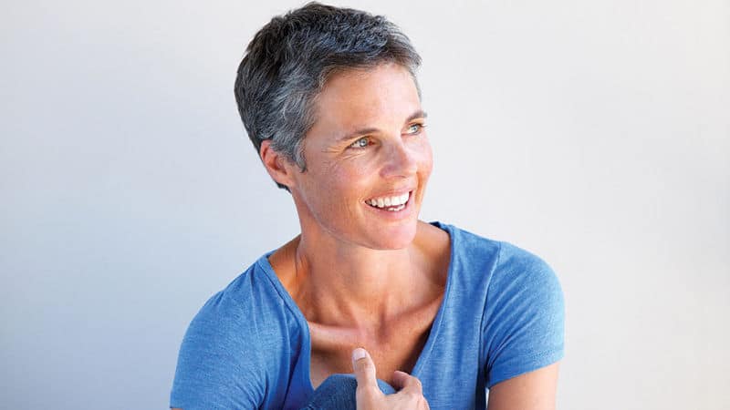 A woman currently going through menopause Image
