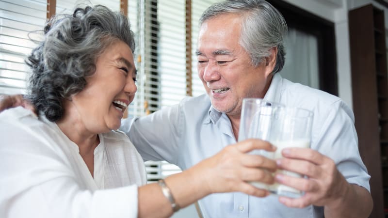 Senior couple drinks milk for their bones