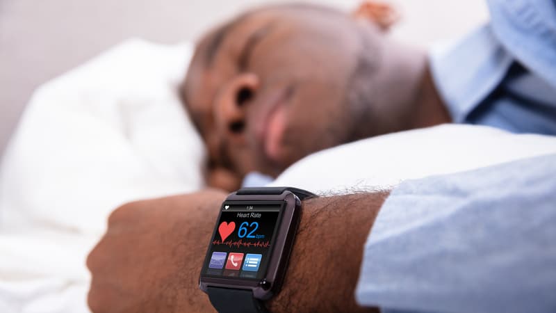 Man sleeps with sleep trackers