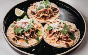 Charred tacos that might have barbecue in them Image