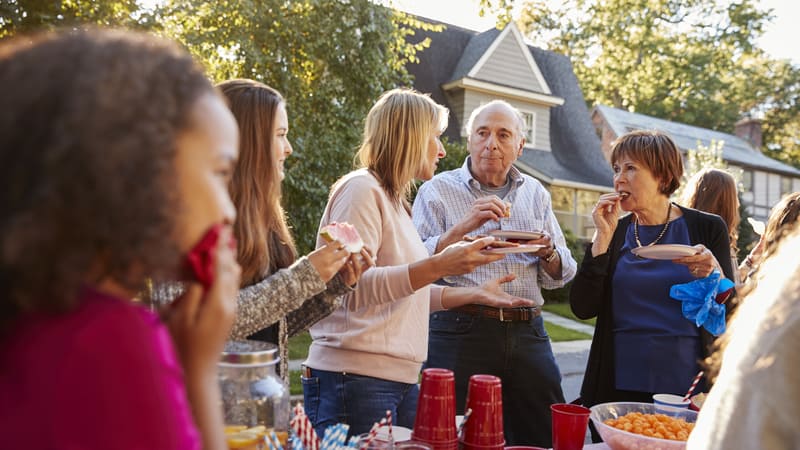 Parents bring kids to the block party