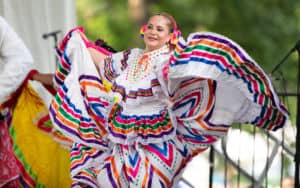 Latina woman at the Cars & Corks event Image