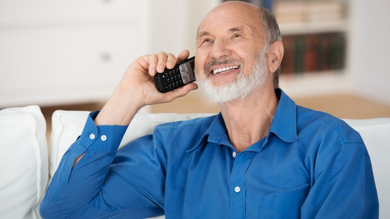 Senior man talking on the phone in Welsh