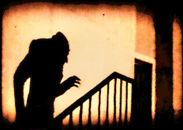 Iconic scary shadow scene from early horror film 'Nosferatu'