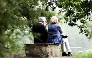 older couple gazing at lake can enjoy boomer retirement preparation Image