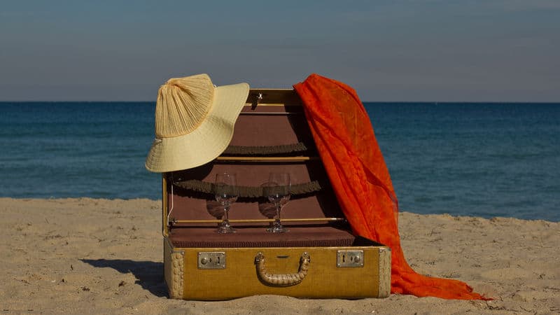 Vintage suitcases on a beach Image