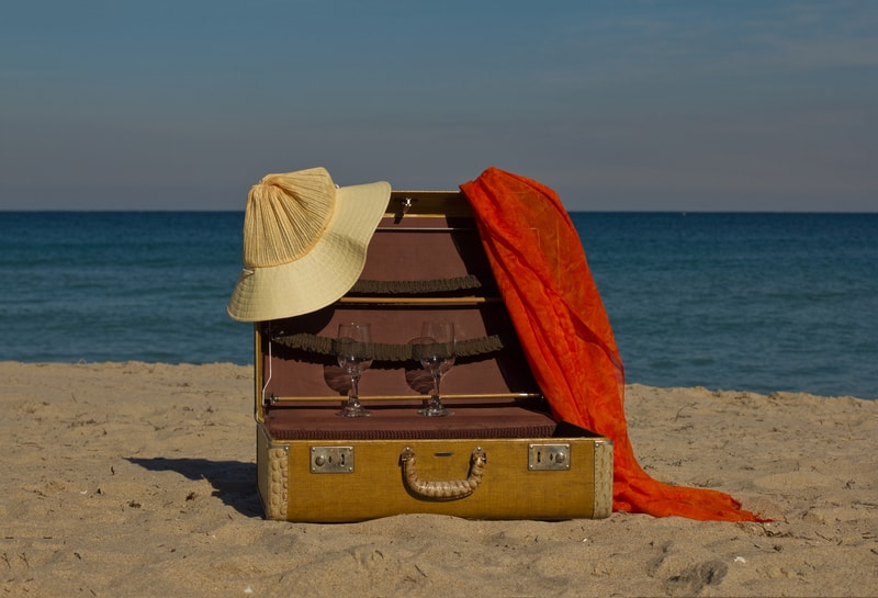 Vintage suitcases on a beach