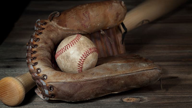 Vintage baseball and bat representing the history of baseball and ballparks in Richmond, Virginia Image