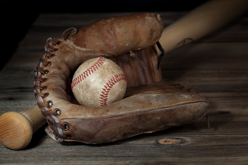 Vintage baseball and bat representing the history of baseball and ballparks in Richmond, Virginia