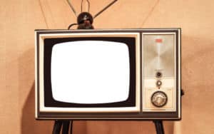 Vintage TV with rabbit ears to promote 10 ad jingles of the 1970s Image