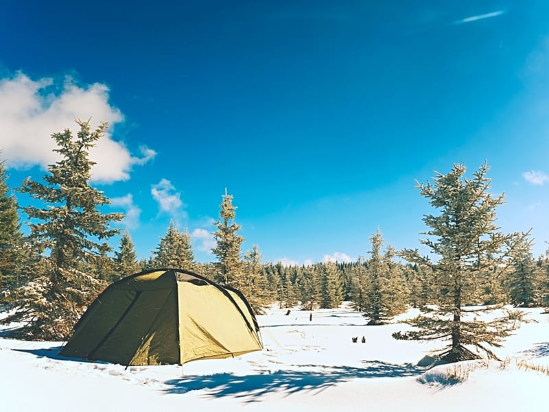 Cold weather camping with snow and tent