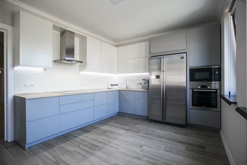 Kitchen with newly painted cabinets, an inexpensive home improvement