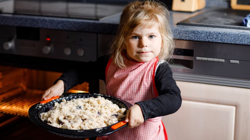 Little girl baking pies