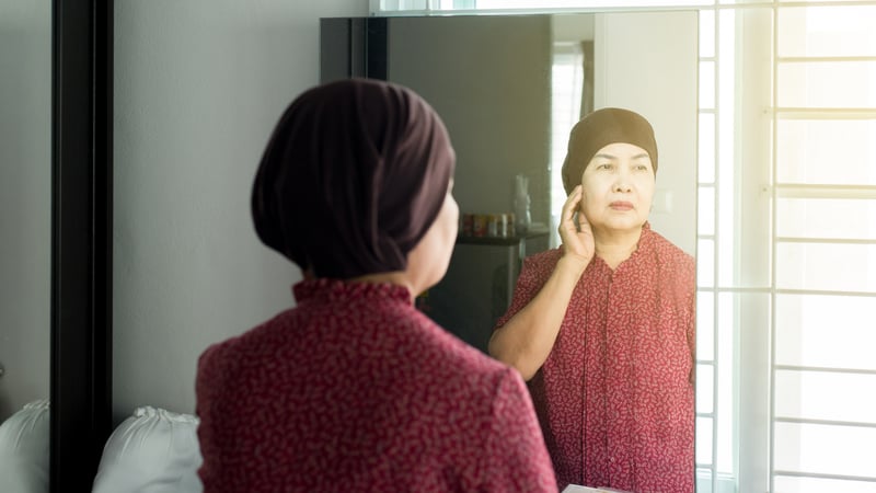 Senior woman receiving cancer treatment