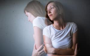 signs and symptoms of depression - young woman suffering anxiety Image