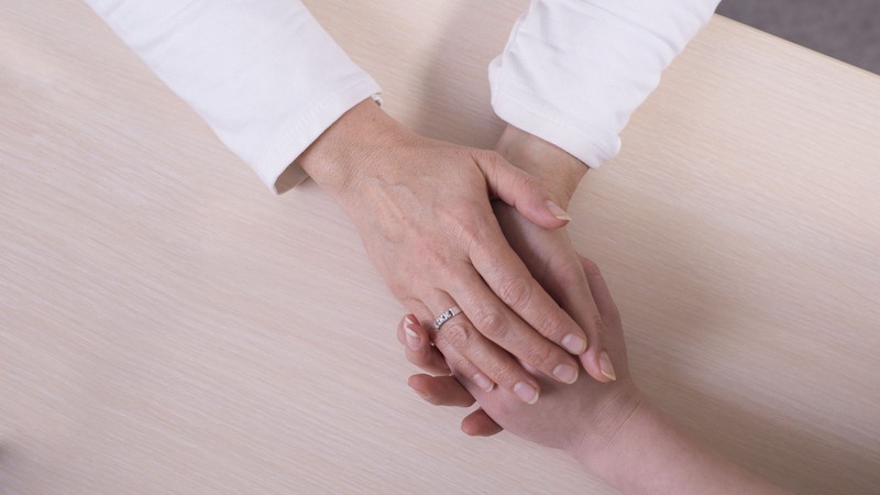 Prayer between healthcare worker and patient